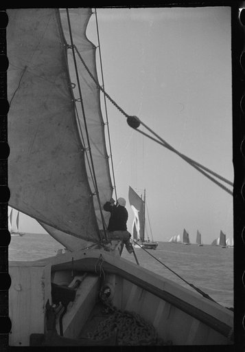 Untitled photo, possibly related to: Summer residents watch the tourist boat arrive from Boston, Provincetown, Massachusetts