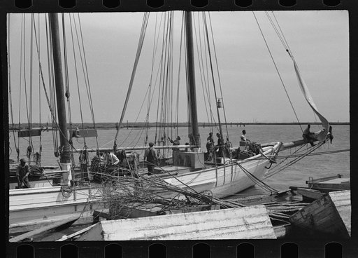Untitled photo, possibly related to: Summer residents watch the tourist boat arrive from Boston, Provincetown, Massachusetts