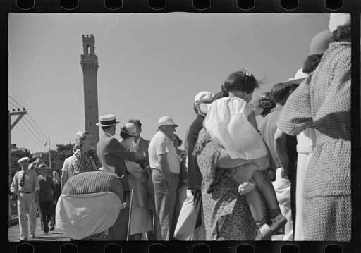 Untitled photo, possibly related to: Summer residents watch the tourist boat arrive from Boston, Provincetown, Massachusetts