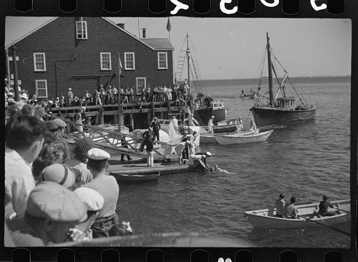 Untitled photo, possibly related to: Summer residents watch the tourist boat arrive from Boston, Provincetown, Massachusetts