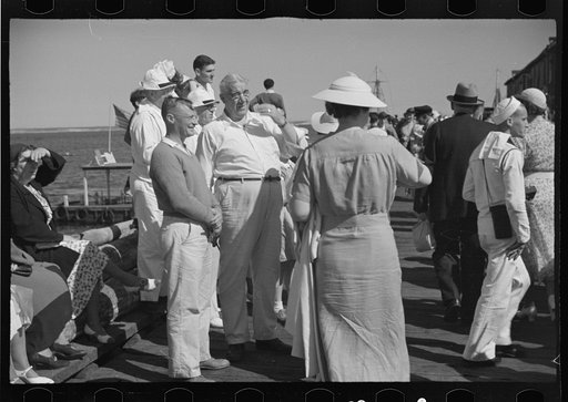 Untitled photo, possibly related to: Summer residents watch the tourist boat arrive from Boston, Provincetown, Massachusetts