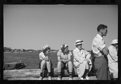 Untitled photo, possibly related to: Summer residents watch the tourist boat arrive from Boston, Provincetown, Massachusetts