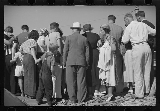 Untitled photo, possibly related to: Summer residents watch the tourist boat arrive from Boston, Provincetown, Massachusetts