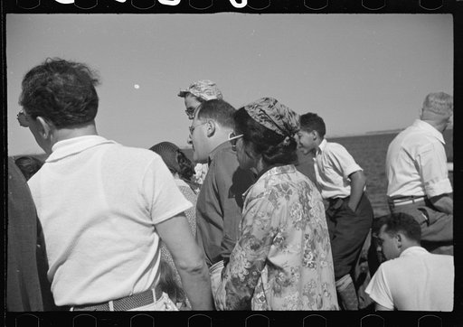 Untitled photo, possibly related to: Summer residents watch the tourist boat arrive from Boston, Provincetown, Massachusetts
