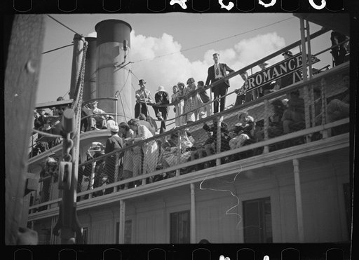 Untitled photo, possibly related to: Summer residents watch the tourist boat arrive from Boston, Provincetown, Massachusetts