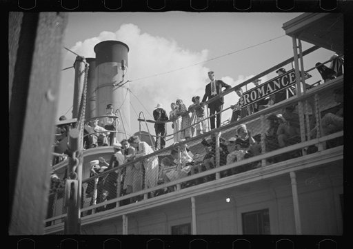 Untitled photo, possibly related to: Summer residents watch the tourist boat arrive from Boston, Provincetown, Massachusetts