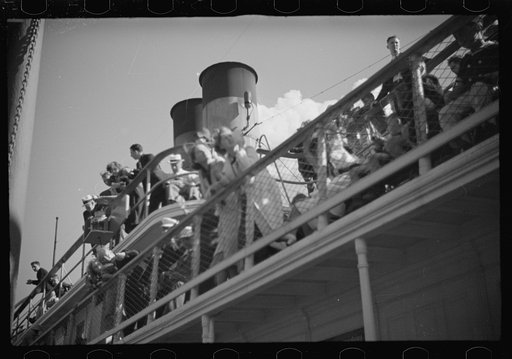 Untitled photo, possibly related to: Summer residents watch the tourist boat arrive from Boston, Provincetown, Massachusetts