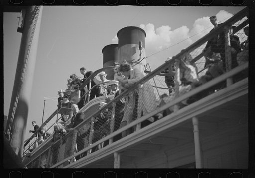 Untitled photo, possibly related to: Summer residents watch the tourist boat arrive from Boston, Provincetown, Massachusetts