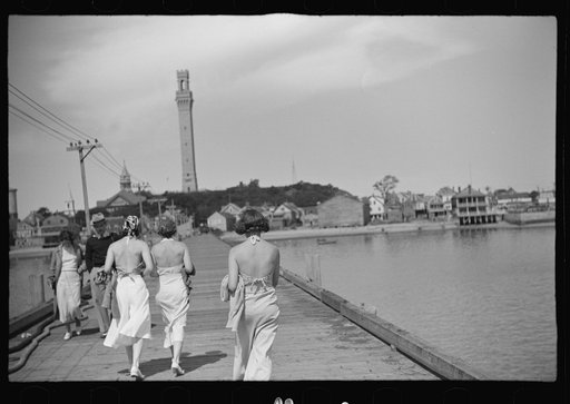 Untitled photo, possibly related to: Summer residents watch the tourist boat arrive from Boston, Provincetown, Massachusetts