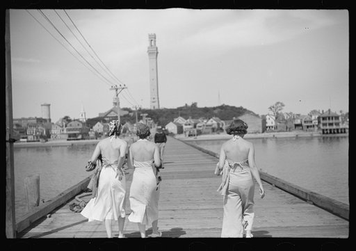 Untitled photo, possibly related to: Summer residents watch the tourist boat arrive from Boston, Provincetown, Massachusetts