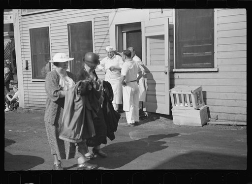 Untitled photo, possibly related to: Tourists getting aboard the "Steel Pier" on their return trip to Boston. During the season two boats arrive daily at two, leave about four, bringing and taking hundreds. Provincetown, Massachusetts