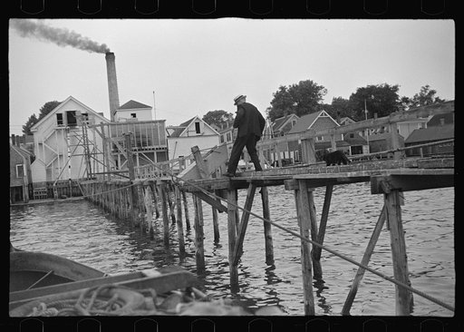 Untitled photo, possibly related to: Aboard a trap fishing boat, the fish freezer and the fish buyer. Fish freezers deliver most of their whiting to the Middle West and West. Squid is used for bait, sold at a dollar a barrel. Trap fishermen who manages to earn between eight hundred and one thousand 