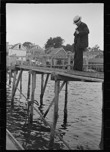 Untitled photo, possibly related to: Aboard a trap fishing boat, the fish freezer and the fish buyer. Fish freezers deliver most of their whiting to the Middle West and West. Squid is used for bait, sold at a dollar a barrel. Trap fishermen who manages to earn between eight hundred and one thousand 
