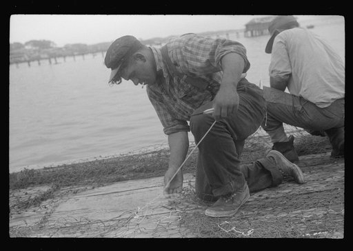 Untitled photo, possibly related to: Fishermen repairing nets, Provincetown, Massachusetts