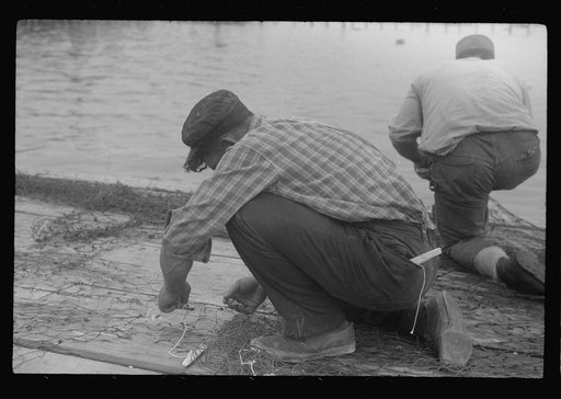 Untitled photo, possibly related to: Fishermen repairing nets, Provincetown, Massachusetts
