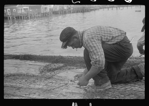 Untitled photo, possibly related to: Fishermen repairing nets, Provincetown, Massachusetts
