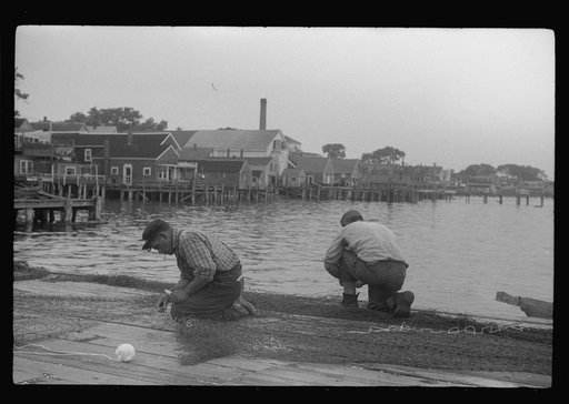 Untitled photo, possibly related to: Fishermen repairing nets, Provincetown, Massachusetts