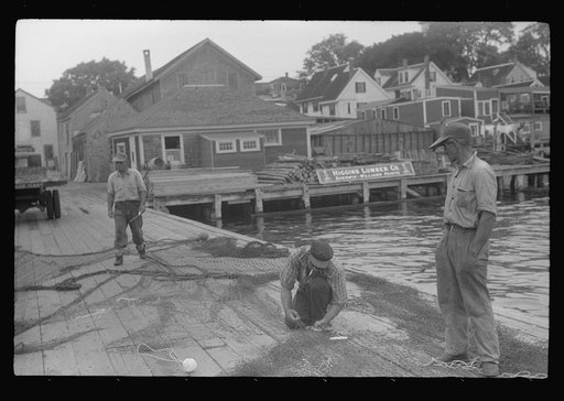Fishermen repairing nets, Provincetown, Massachusetts