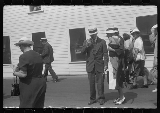 Untitled photo, possibly related to: Tourists, fresh off the boat from Boston. With only two hours in town, they buy seashells dinners, trinkets and rides on the sight seeing bus. Provincetown, Massachusetts