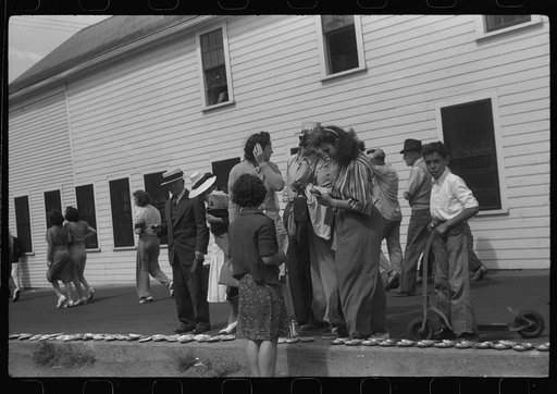 Untitled photo, possibly related to: Tourists, fresh off the boat from Boston. With only two hours in town, they buy seashells dinners, trinkets and rides on the sight seeing bus. Provincetown, Massachusetts
