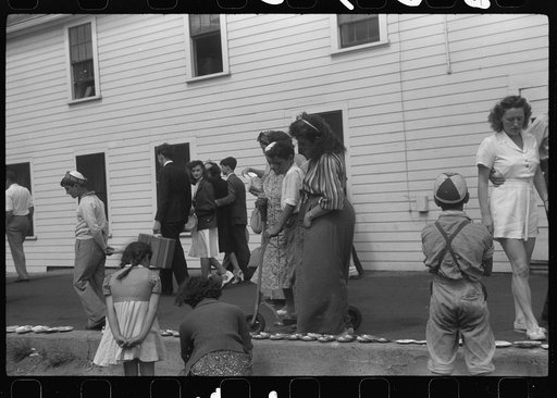 Untitled photo, possibly related to: Tourists, fresh off the boat from Boston. With only two hours in town, they buy seashells dinners, trinkets and rides on the sight seeing bus. Provincetown, Massachusetts