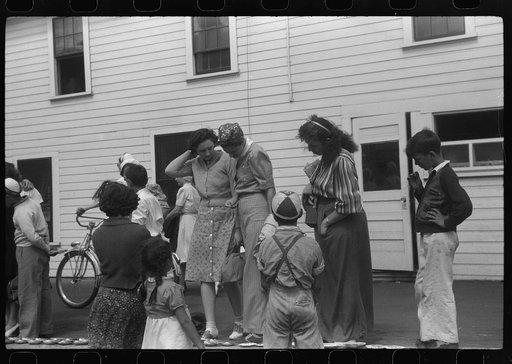 Untitled photo, possibly related to: Tourists, fresh off the boat from Boston. With only two hours in town, they buy seashells dinners, trinkets and rides on the sight seeing bus. Provincetown, Massachusetts