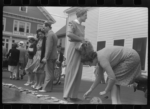 Untitled photo, possibly related to: Tourists, fresh off the boat from Boston. With only two hours in town, they buy seashells dinners, trinkets and rides on the sight seeing bus. Provincetown, Massachusetts