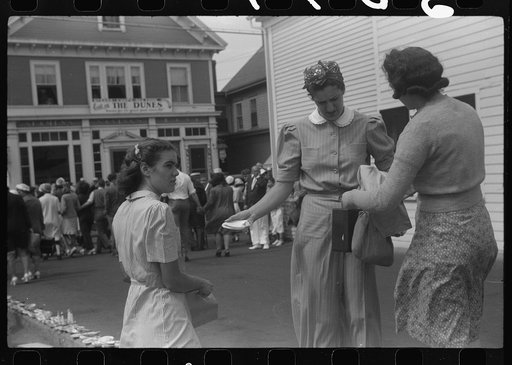 Untitled photo, possibly related to: Tourists, fresh off the boat from Boston. With only two hours in town, they buy seashells dinners, trinkets and rides on the sight seeing bus. Provincetown, Massachusetts