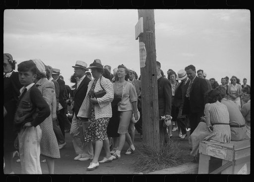 Untitled photo, possibly related to: Tourists, fresh off the boat from Boston. With only two hours in town, they buy seashells dinners, trinkets and rides on the sight seeing bus. Provincetown, Massachusetts