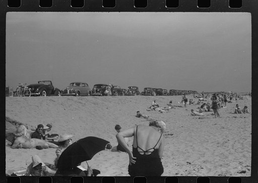 Untitled photo, possibly related to: Beach scene at "New Beach," the most popular beach near Provincetown. Regular bus service makes this beach easily available; lack of bath houses causes a great deal of picturesque dressing and undressing in and behind parked cars. Provincetown, Massachusetts