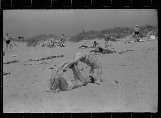 Untitled photo, possibly related to: Beach scene at "New Beach," the most popular beach near Provincetown. Regular bus service makes this beach easily available; lack of bath houses causes a great deal of picturesque dressing and undressing in and behind parked cars. Provincetown, Massachusetts