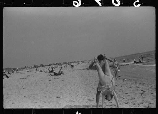 Untitled photo, possibly related to: Beach scene at "New Beach," the most popular beach near Provincetown. Regular bus service makes this beach easily available; lack of bath houses causes a great deal of picturesque dressing and undressing in and behind parked cars. Provincetown, Massachusetts