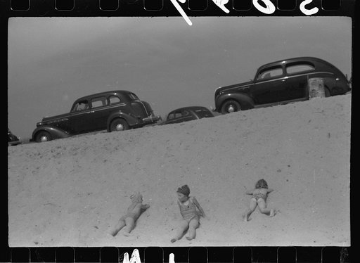 Untitled photo, possibly related to: Beach scene at "New Beach," the most popular beach near Provincetown. Regular bus service makes this beach easily available; lack of bath houses causes a great deal of picturesque dressing and undressing in and behind parked cars. Provincetown, Massachusetts