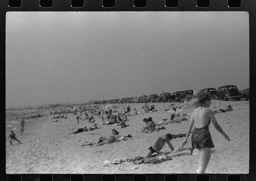 Untitled photo, possibly related to: Beach scene at "New Beach," the most popular beach near Provincetown. Regular bus service makes this beach easily available; lack of bath houses causes a great deal of picturesque dressing and undressing in and behind parked cars. Provincetown, Massachusetts