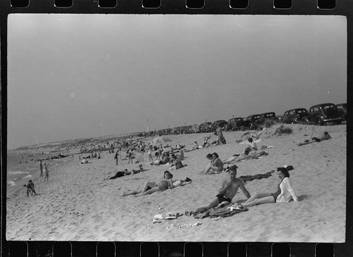 Untitled photo, possibly related to: Beach scene at "New Beach," the most popular beach near Provincetown. Regular bus service makes this beach easily available; lack of bath houses causes a great deal of picturesque dressing and undressing in and behind parked cars. Provincetown, Massachusetts