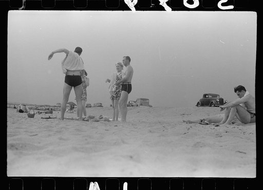 Untitled photo, possibly related to: Beach scene at "New Beach," the most popular beach near Provincetown. Regular bus service makes this beach easily available; lack of bath houses causes a great deal of picturesque dressing and undressing in and behind parked cars. Provincetown, Massachusetts
