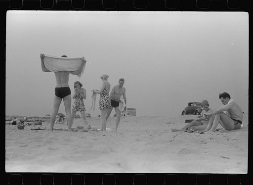 Untitled photo, possibly related to: Beach scene at "New Beach," the most popular beach near Provincetown. Regular bus service makes this beach easily available; lack of bath houses causes a great deal of picturesque dressing and undressing in and behind parked cars. Provincetown, Massachusetts