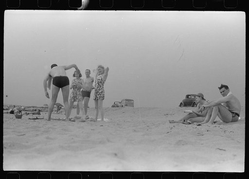Untitled photo, possibly related to: Beach scene at "New Beach," the most popular beach near Provincetown. Regular bus service makes this beach easily available; lack of bath houses causes a great deal of picturesque dressing and undressing in and behind parked cars. Provincetown, Massachusetts