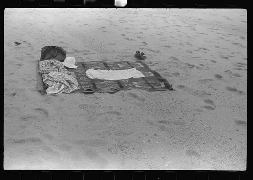 Beach scene at "New Beach," the most popular beach near Provincetown. Regular bus service makes this beach easily available; lack of bath houses causes a great deal of picturesque dressing and undressing in and behind parked cars. Provincetown, Massachusetts