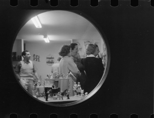 Untitled photo, possibly related to: Shoppers at night in souvenir store, Provincetown, Massachusetts