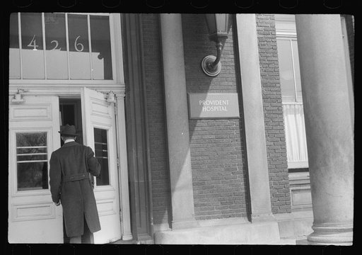 Untitled photo, possibly related to: Staff doctor entering Provident Hospital, Chicago, Illinois