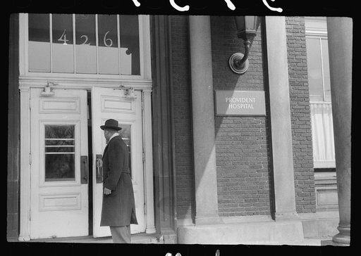 Staff doctor entering Provident Hospital, Chicago, Illinois