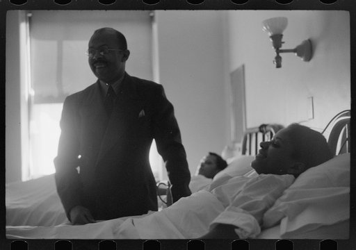 Untitled photo, possibly related to: Staff doctor entering Provident Hospital, Chicago, Illinois