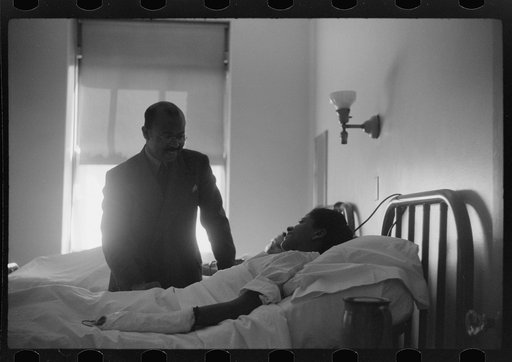 Untitled photo, possibly related to: Staff doctor entering Provident Hospital, Chicago, Illinois
