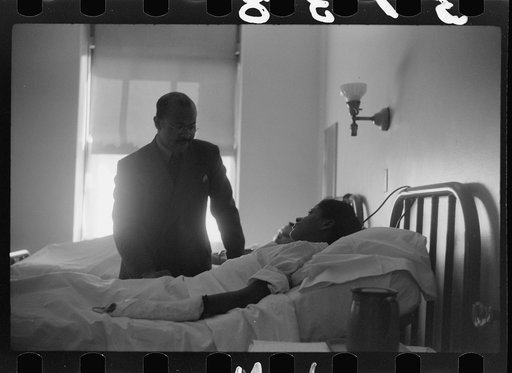 Untitled photo, possibly related to: Staff doctor entering Provident Hospital, Chicago, Illinois