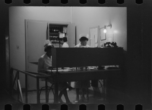 Untitled photo, possibly related to: Staff doctor entering Provident Hospital, Chicago, Illinois