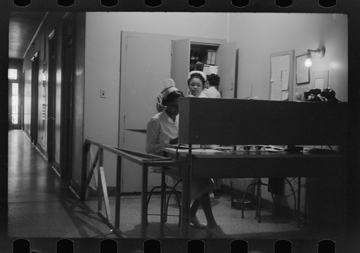 Untitled photo, possibly related to: Staff doctor entering Provident Hospital, Chicago, Illinois
