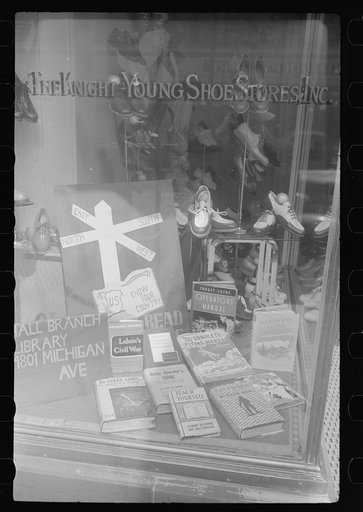 Books on display in show store window, 47th Street, Chicago, Illinois