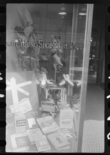 Untitled photo, possibly related to: Books on display in show store window, 47th Street, Chicago, Illinois