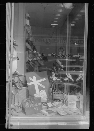 Untitled photo, possibly related to: Books on display in show store window, 47th Street, Chicago, Illinois